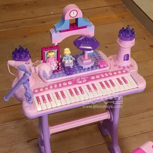 پیانو اسباب بازی صورتی با میز بازی و میکروفون